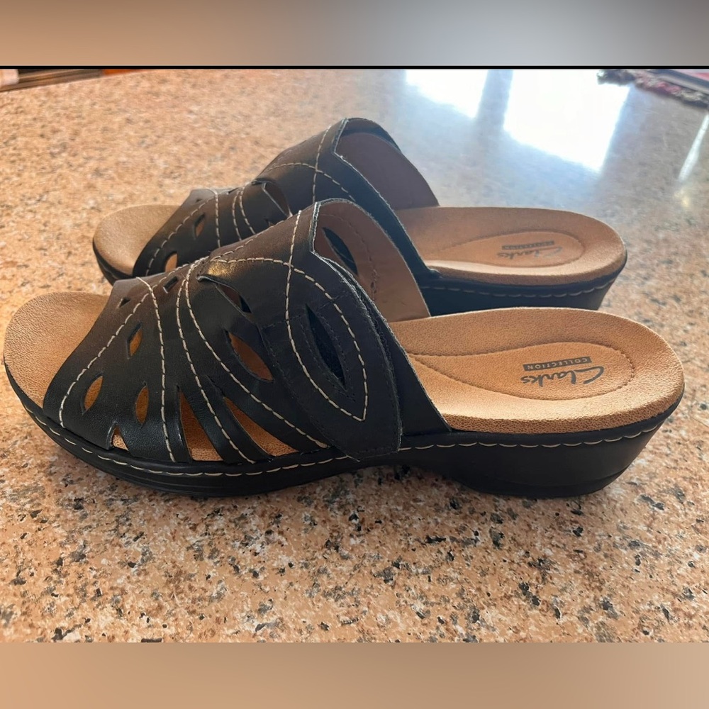 New, never worn, Clarks leather sandals with adjustable width - women’s size 9.